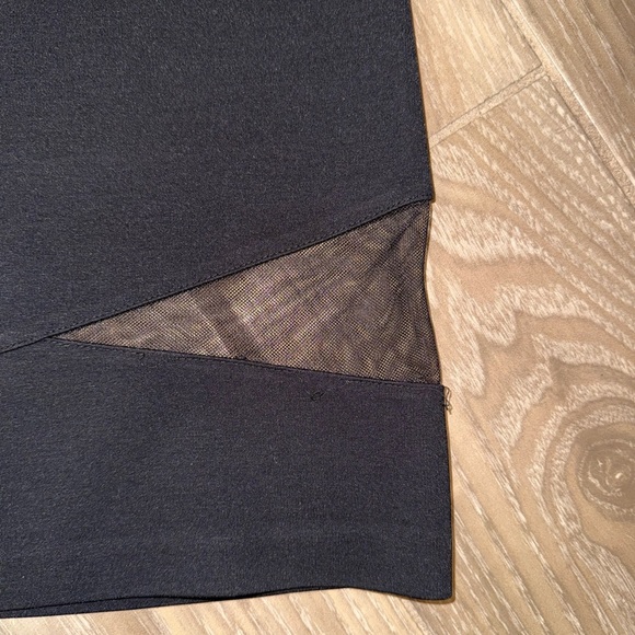 Black mini skirt BB Dakota featuring a unique diagonal sheer mesh panel detail.4 - Picture 8 of 8